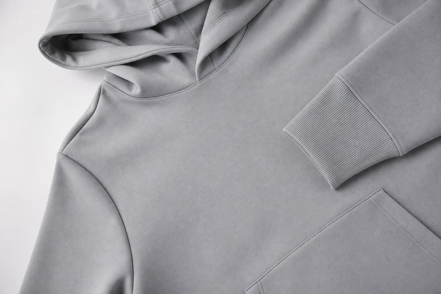 Close-up of golf hoodie hood, cuff, and pocket construction